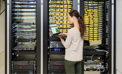 A person standing in front of a server