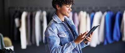 A person holding a tablet.