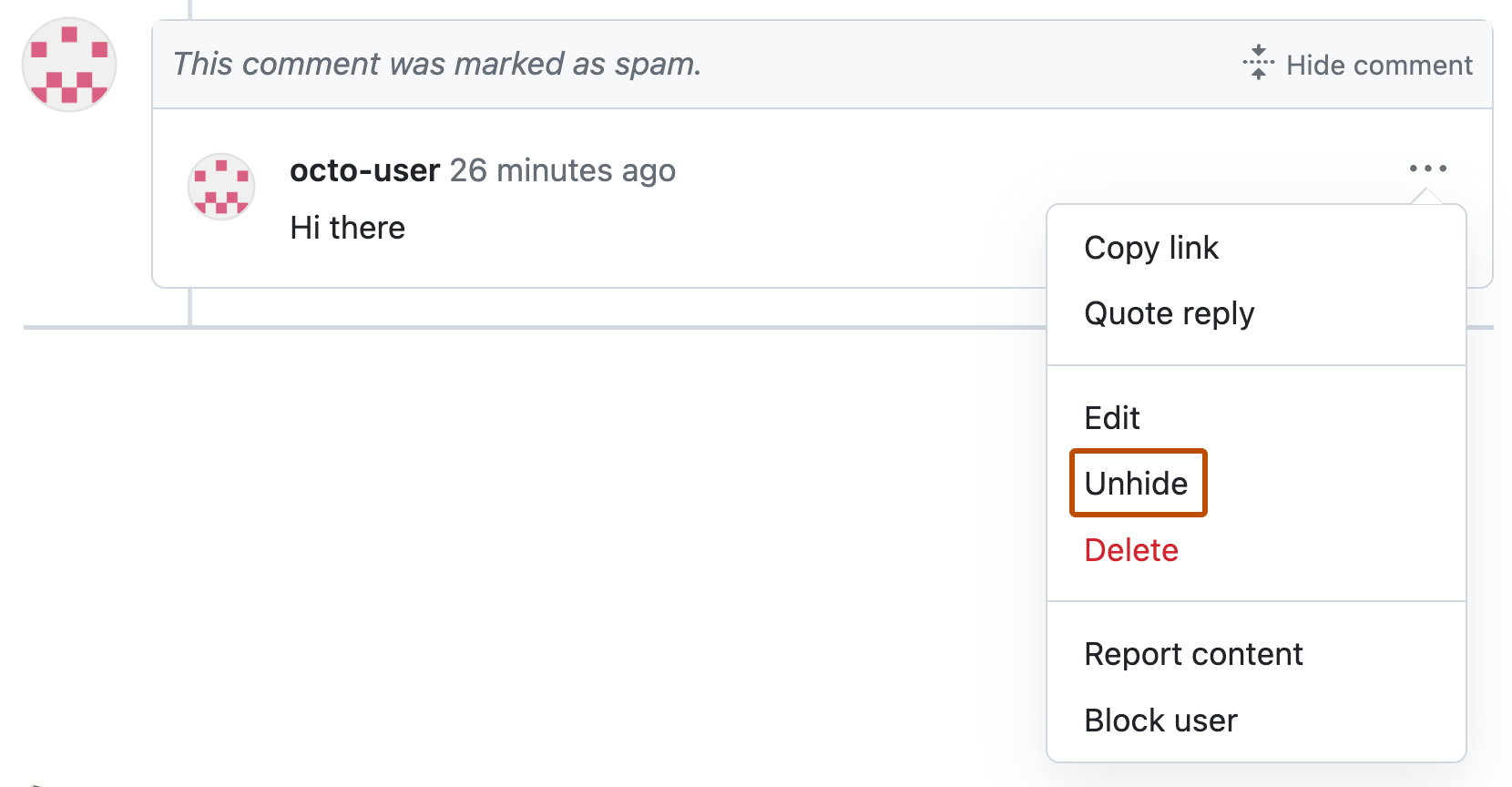 Screenshot of a pull request comment marked as spam. Below an icon of three dots, a dropdown menu is expanded, and "Unhide" is outlined in orange.