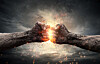 Two clenched fists collide in a dramatic illustration with sparks and a dark background.