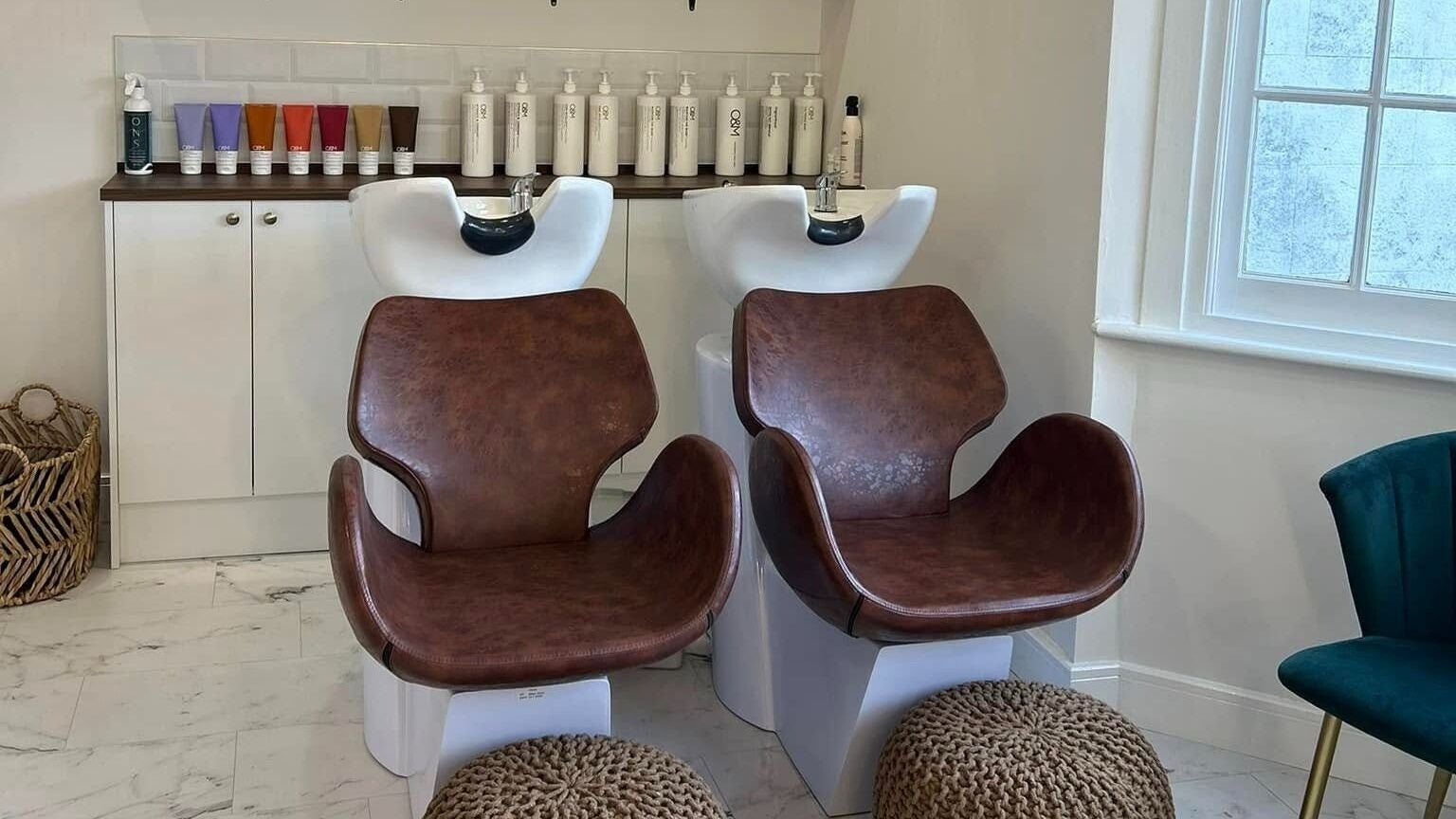 Comfortable salon wash stations at Manes Hair Space, Tenterden, England, GB, offering relaxing hair treatments.