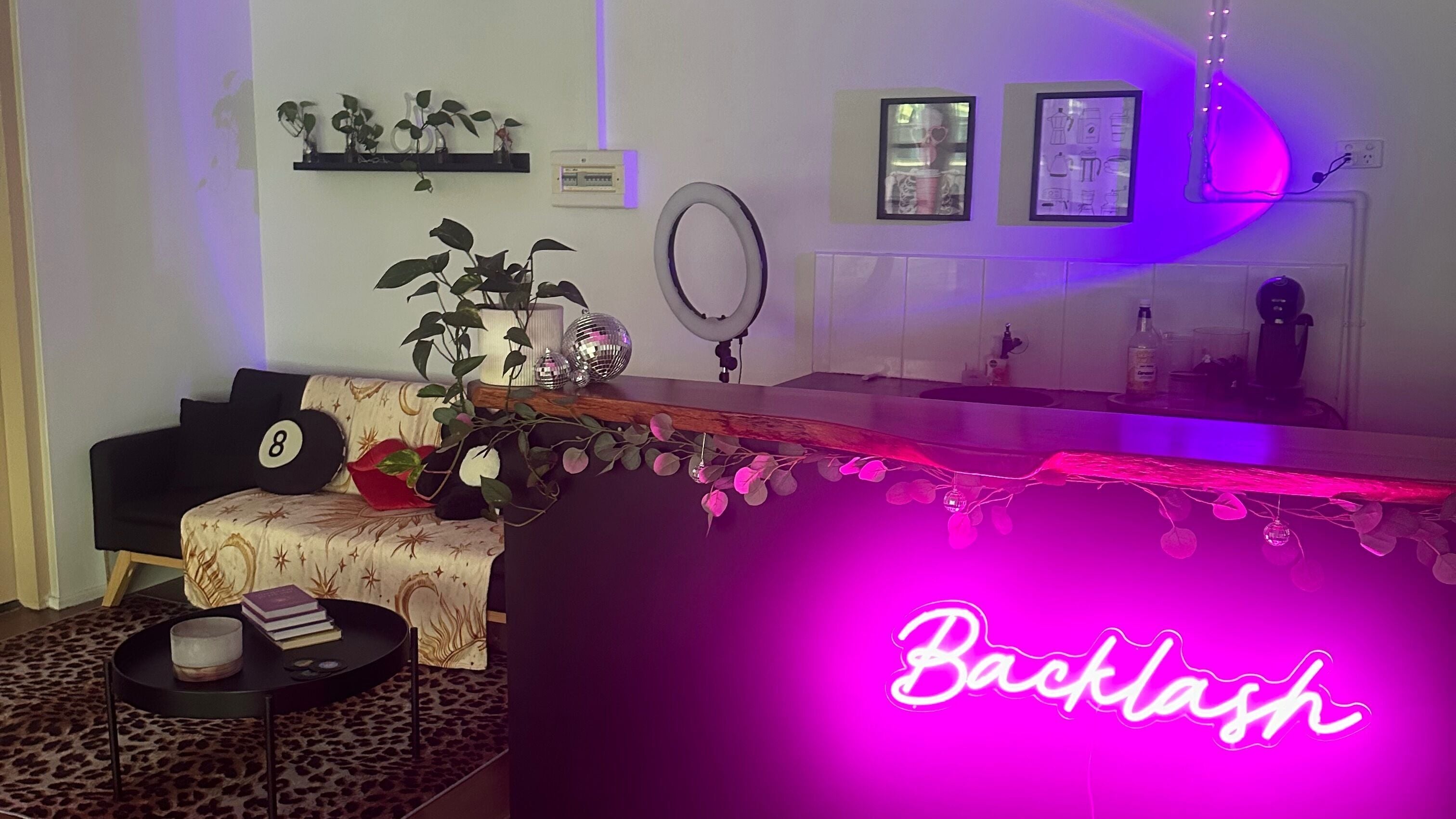 Backlash Beauty venue in Newstead, Queensland, AU showcasing a modern and inviting interior with vibrant lighting.