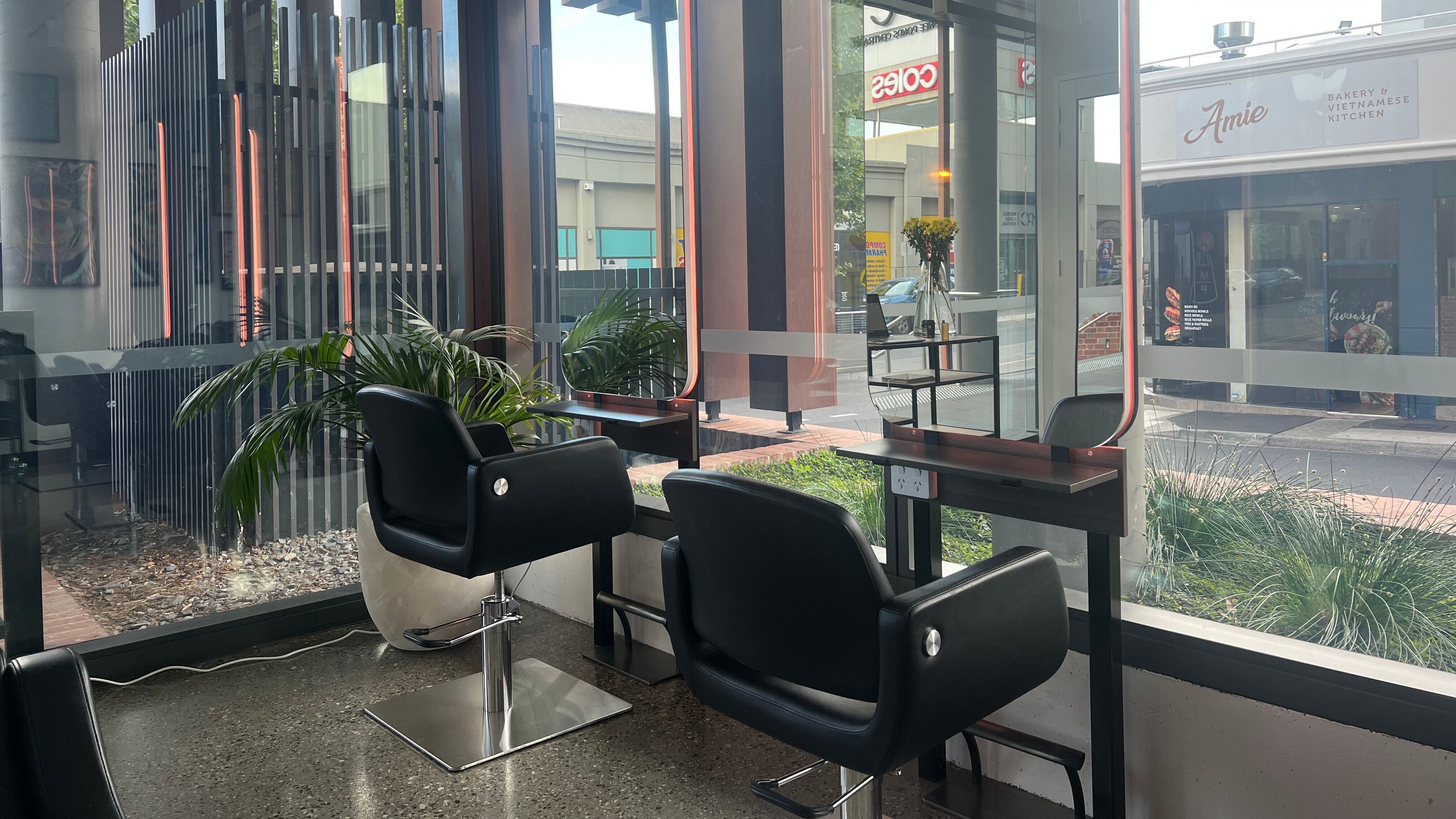 Elegant salon chairs at Navy Brown, Melbourne, Victoria, AU, offering stylish beauty and wellness experiences.