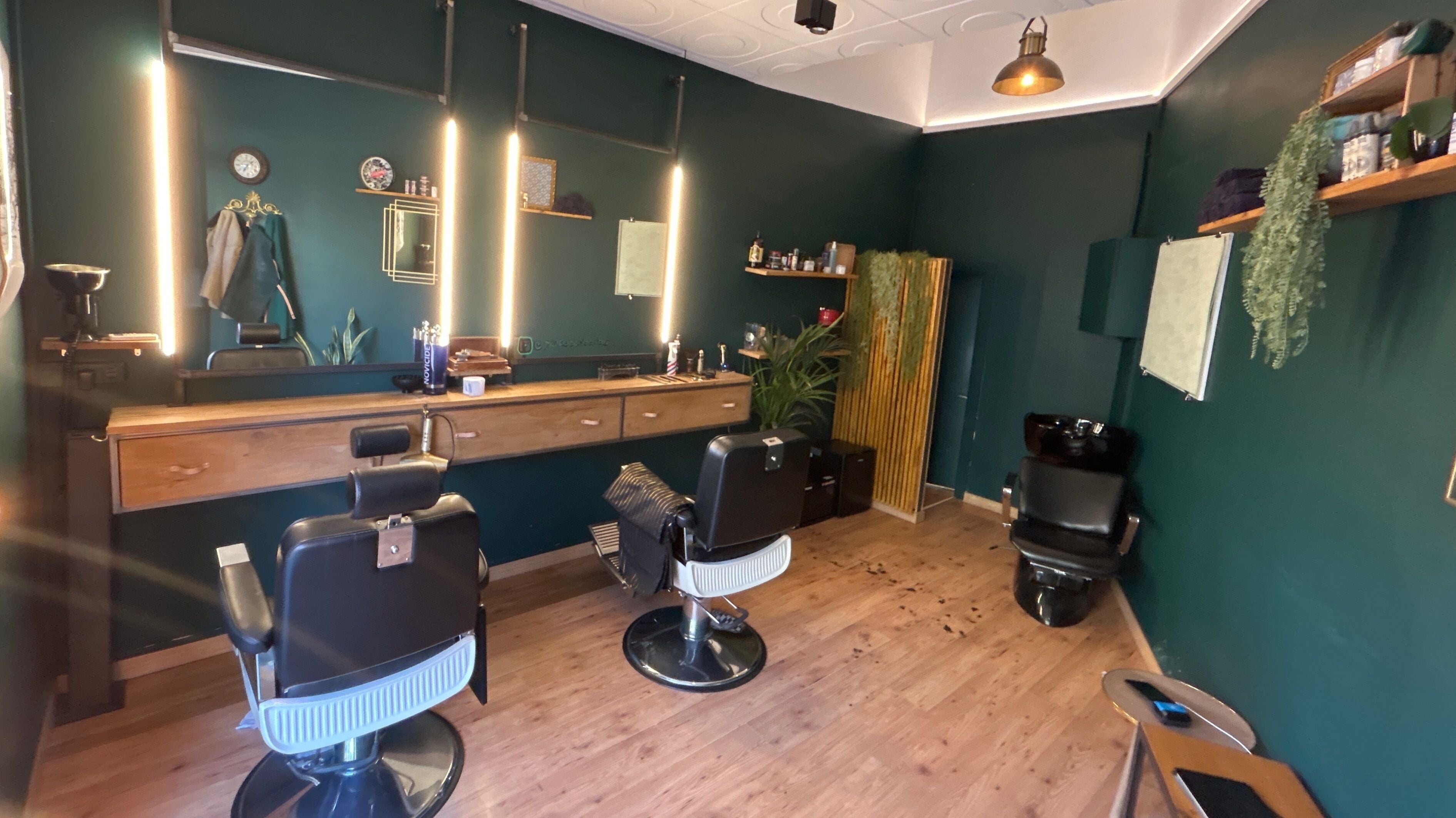 Sleek interior of Porter BCN Barbershop in Barcelona, Catalunya, ES, featuring modern decor and barber chairs.