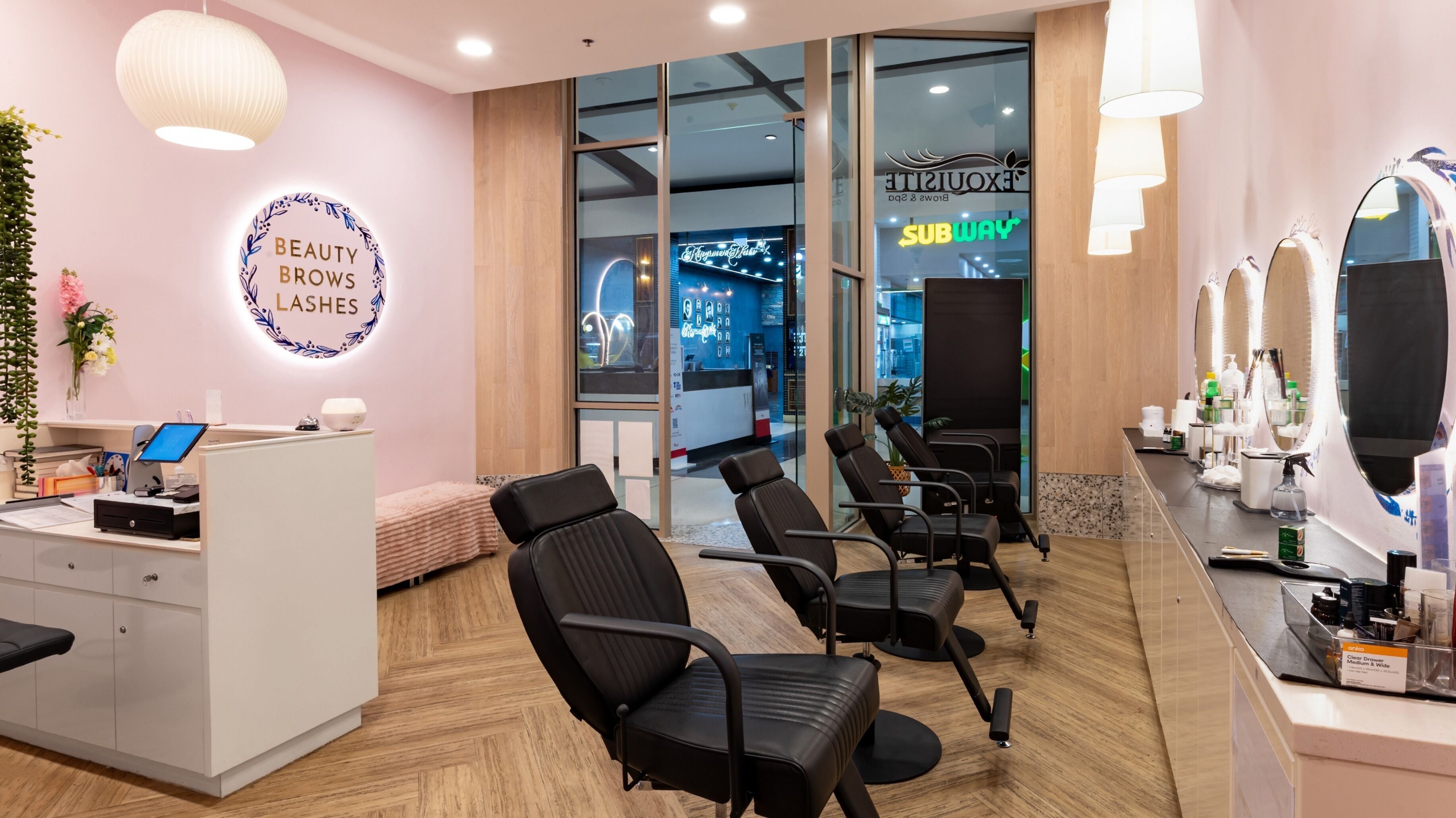 Chic interior of Exquisite Brows and Spa Southland, Melbourne, Victoria, AU showcasing beauty chairs and decor.
