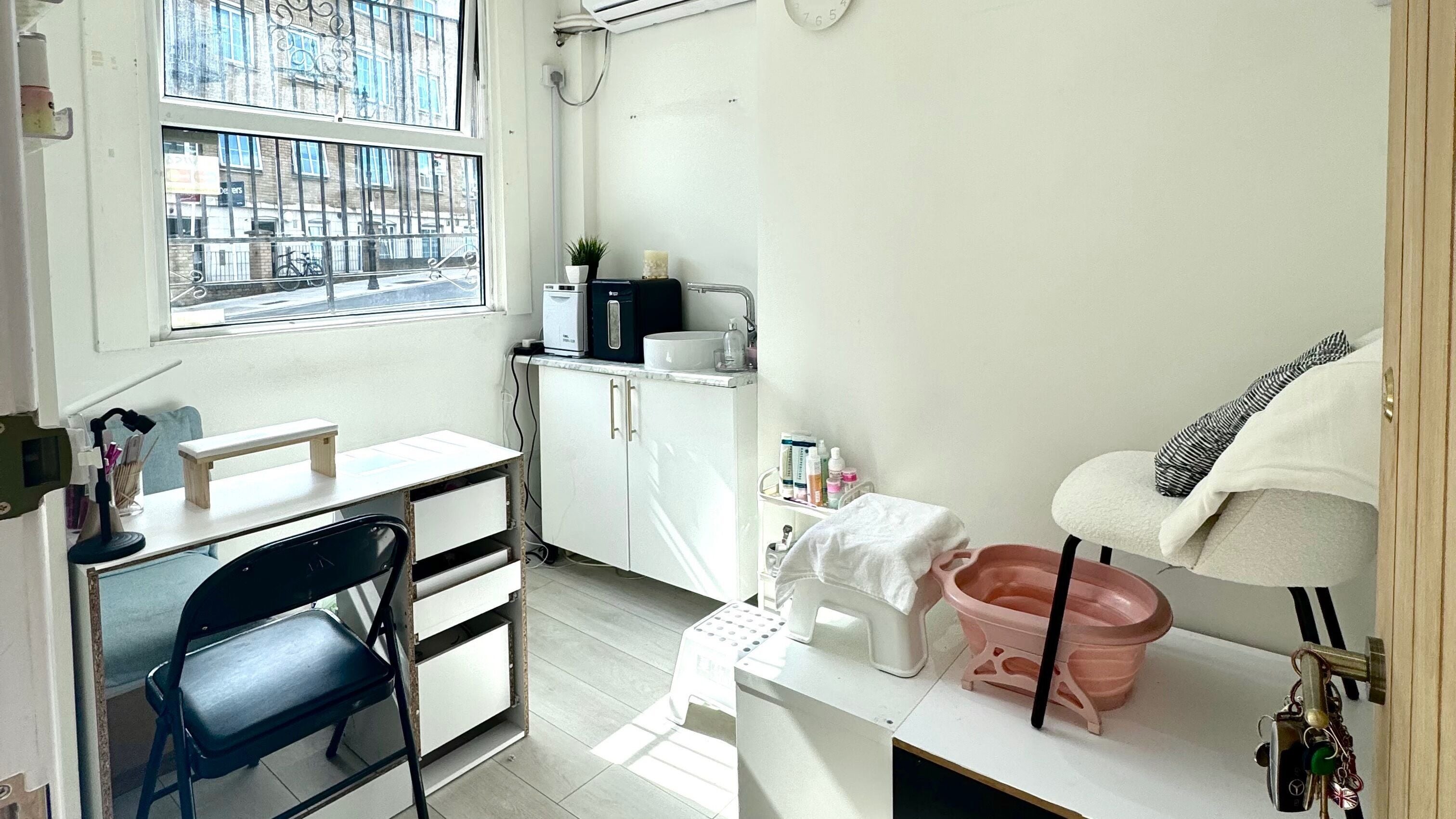Serene beauty space at Miche in London, England, GB, featuring a manicure station and relaxing chair.