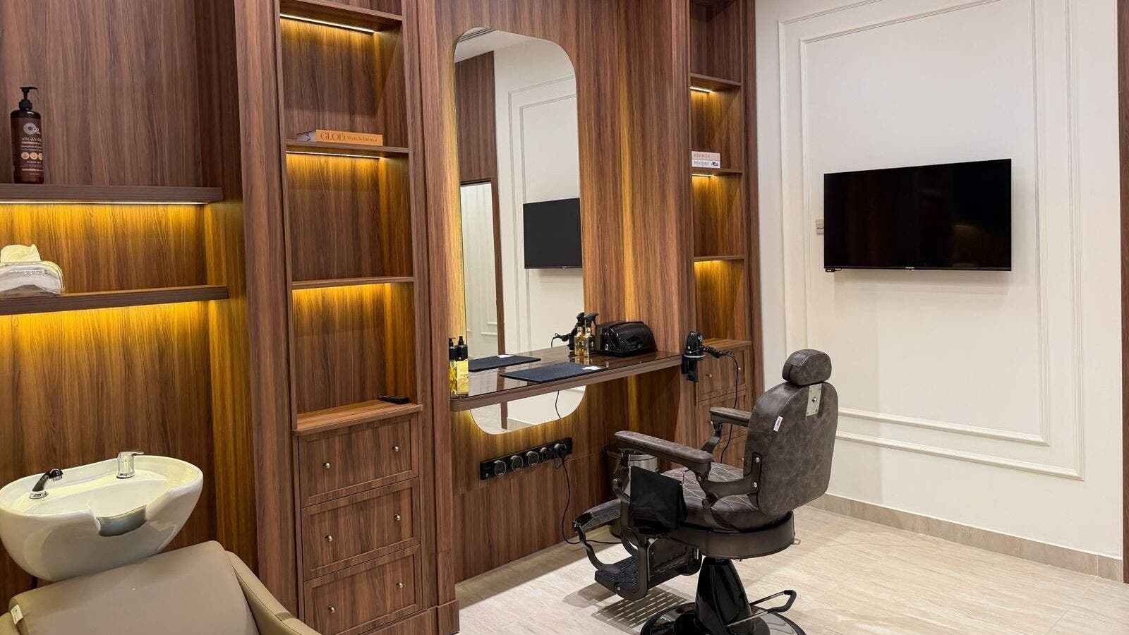 Elegant styling station at Black Blade Barber, Riyadh, Riyadh Province, SA, featuring a modern chair and mirror setup.