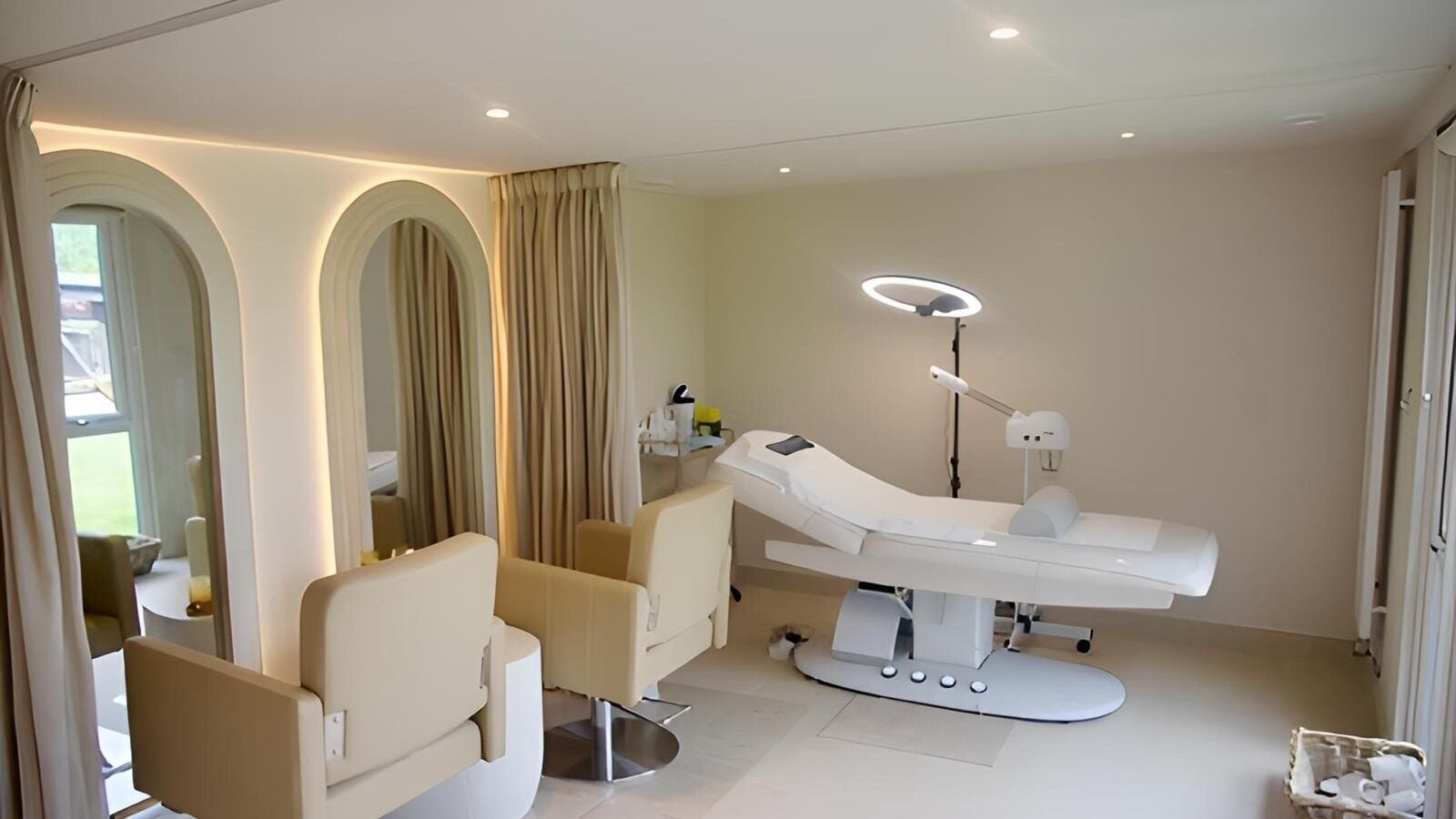 Elegant treatment room at Facial Concept in Virginia Water, England, GB featuring modern equipment and luxe decor.