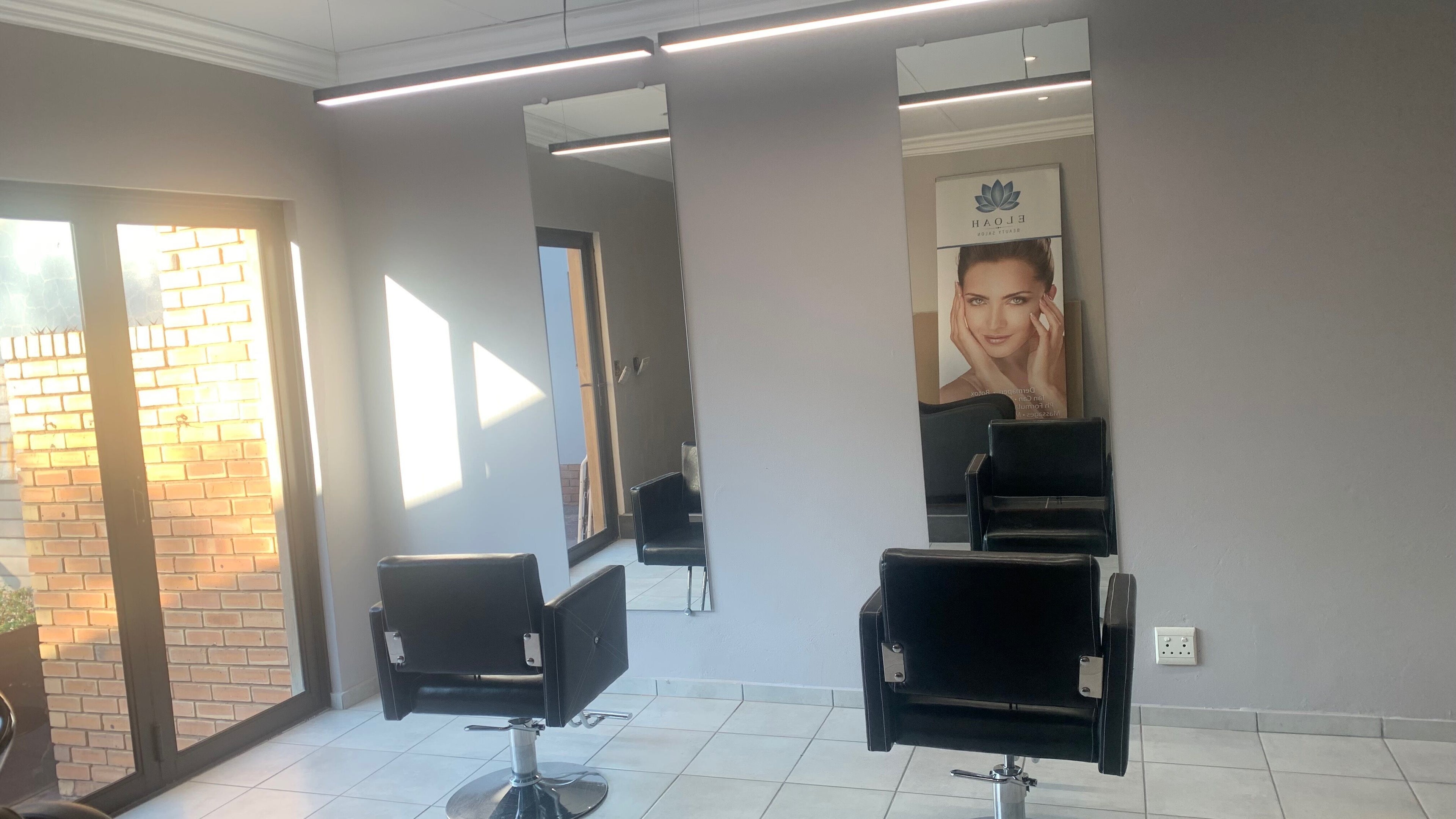 Modern salon chairs and mirrors at Eloah Aesthetic Clinic & Salon - Rooihuiskraal, Centurion, Gauteng, ZA.