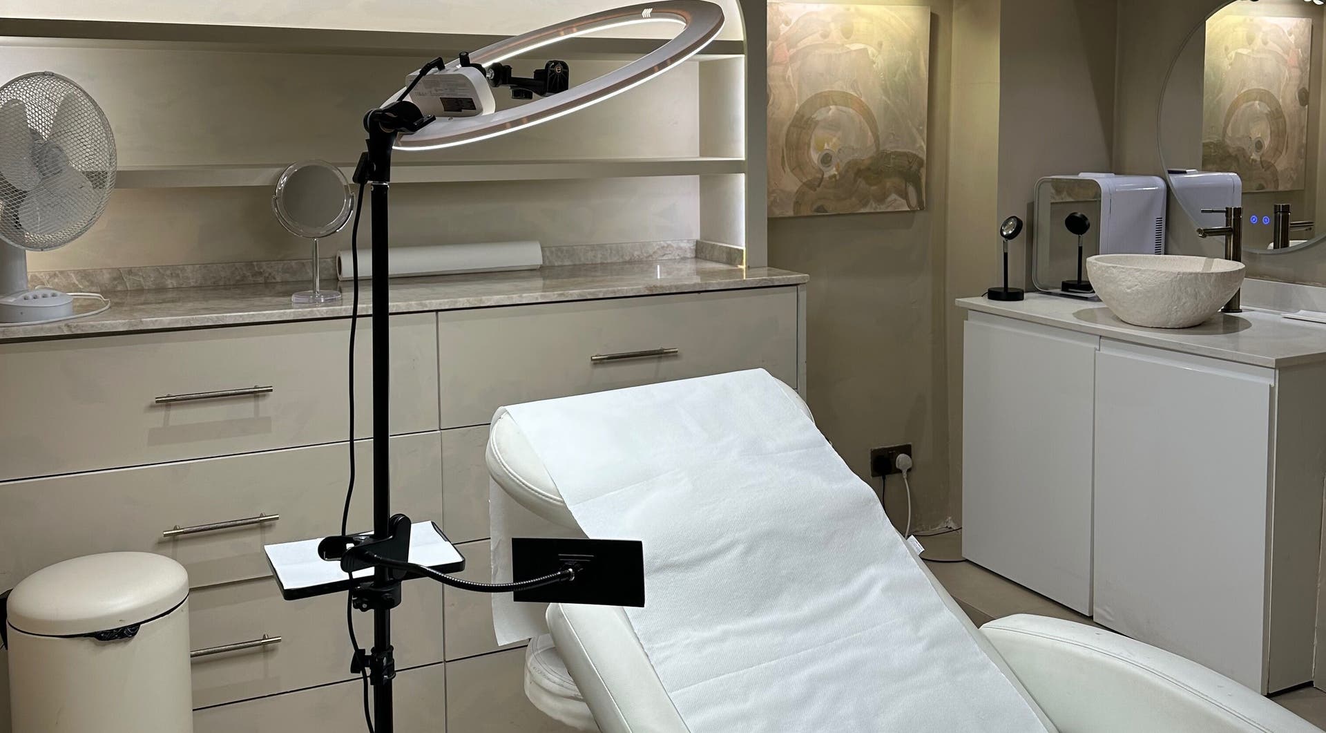 Elegant treatment room at Sugar Cane Salon, London, England, GB, featuring a modern recliner and ambient lighting.