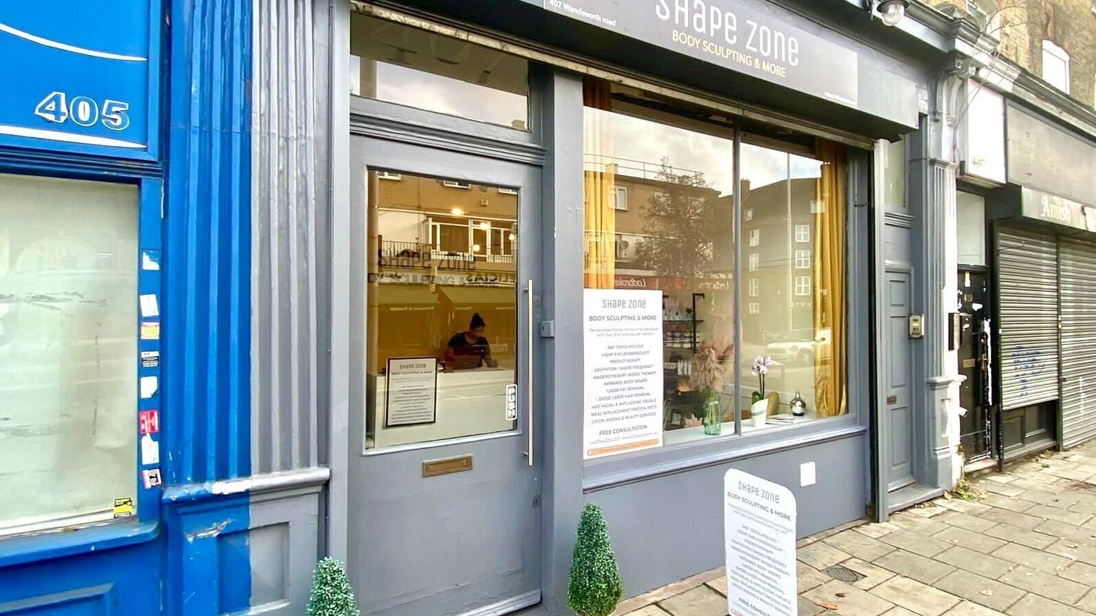 Entrance of Shape Zone London, a body sculpting venue in London, England, GB with modern gray exterior.