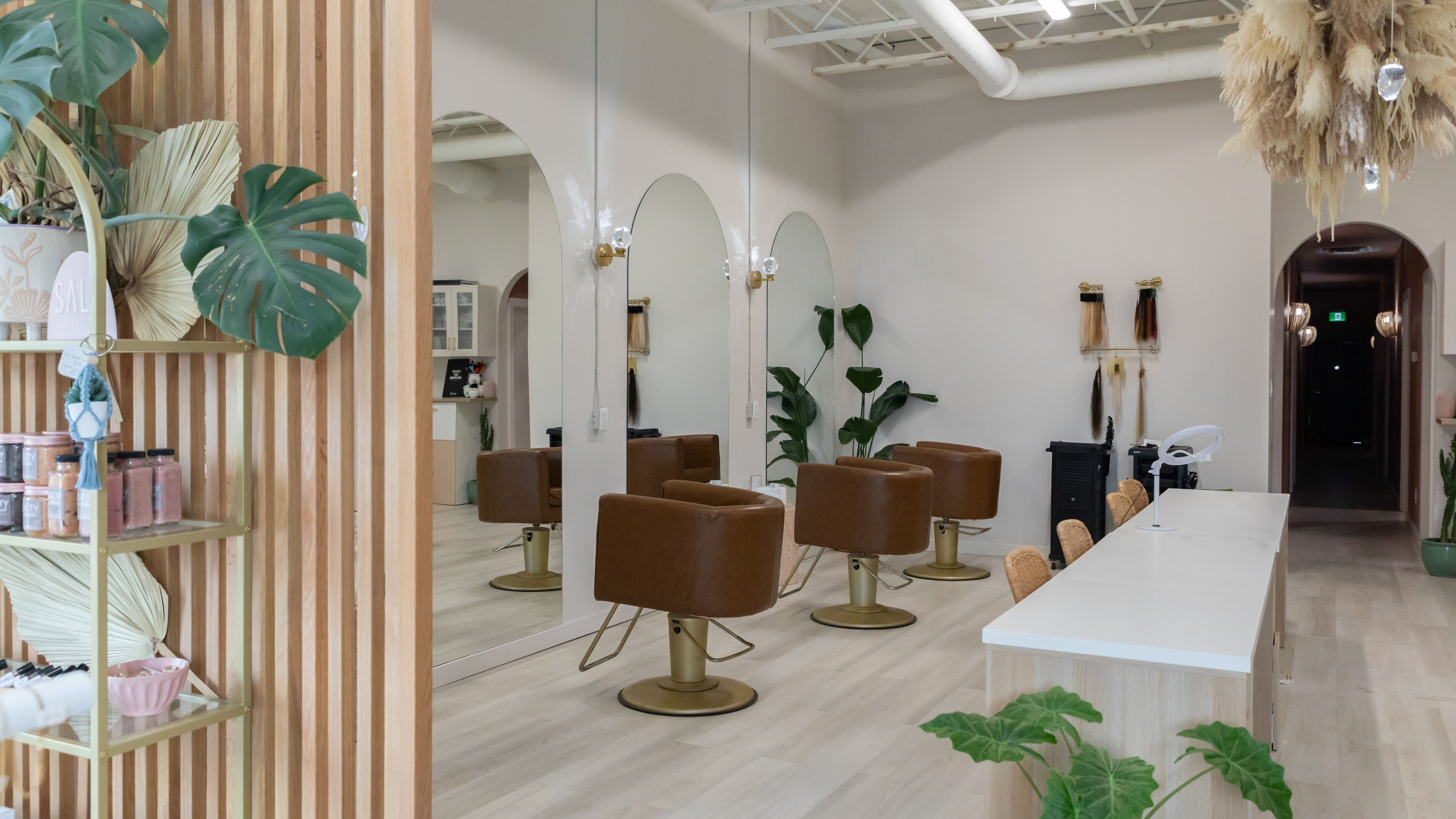 Elegant salon chairs and decor at Salt Day Spa, Leduc, Alberta, CA, showcasing modern wellness ambiance.