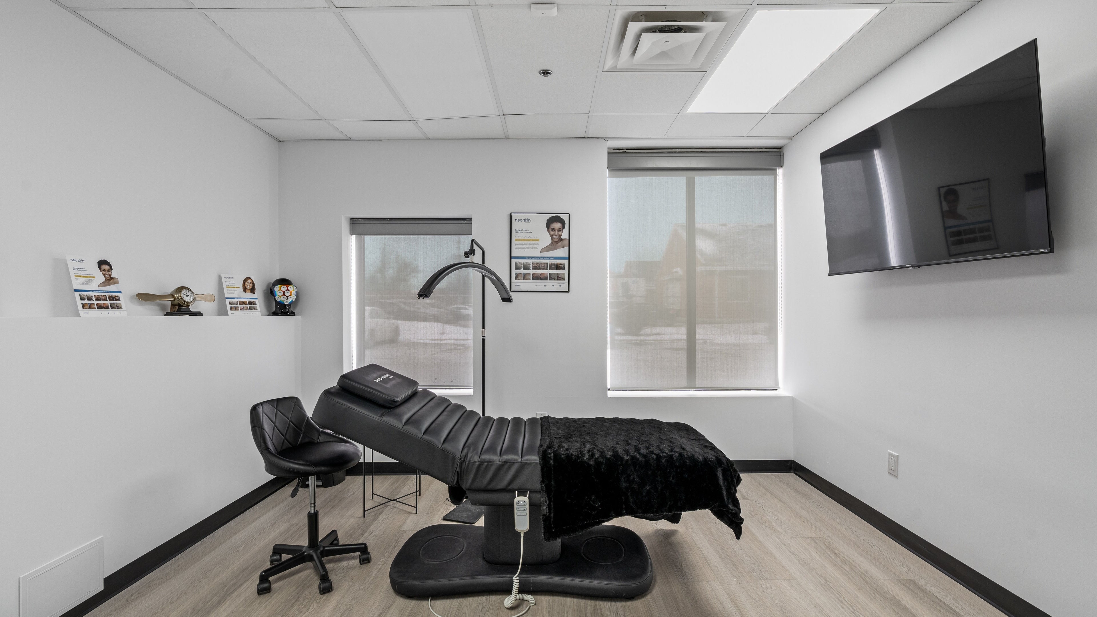 Relaxing spa room at Beauty Matched Med Spa, Sarnia, Ontario, CA, featuring a modern black massage chair.