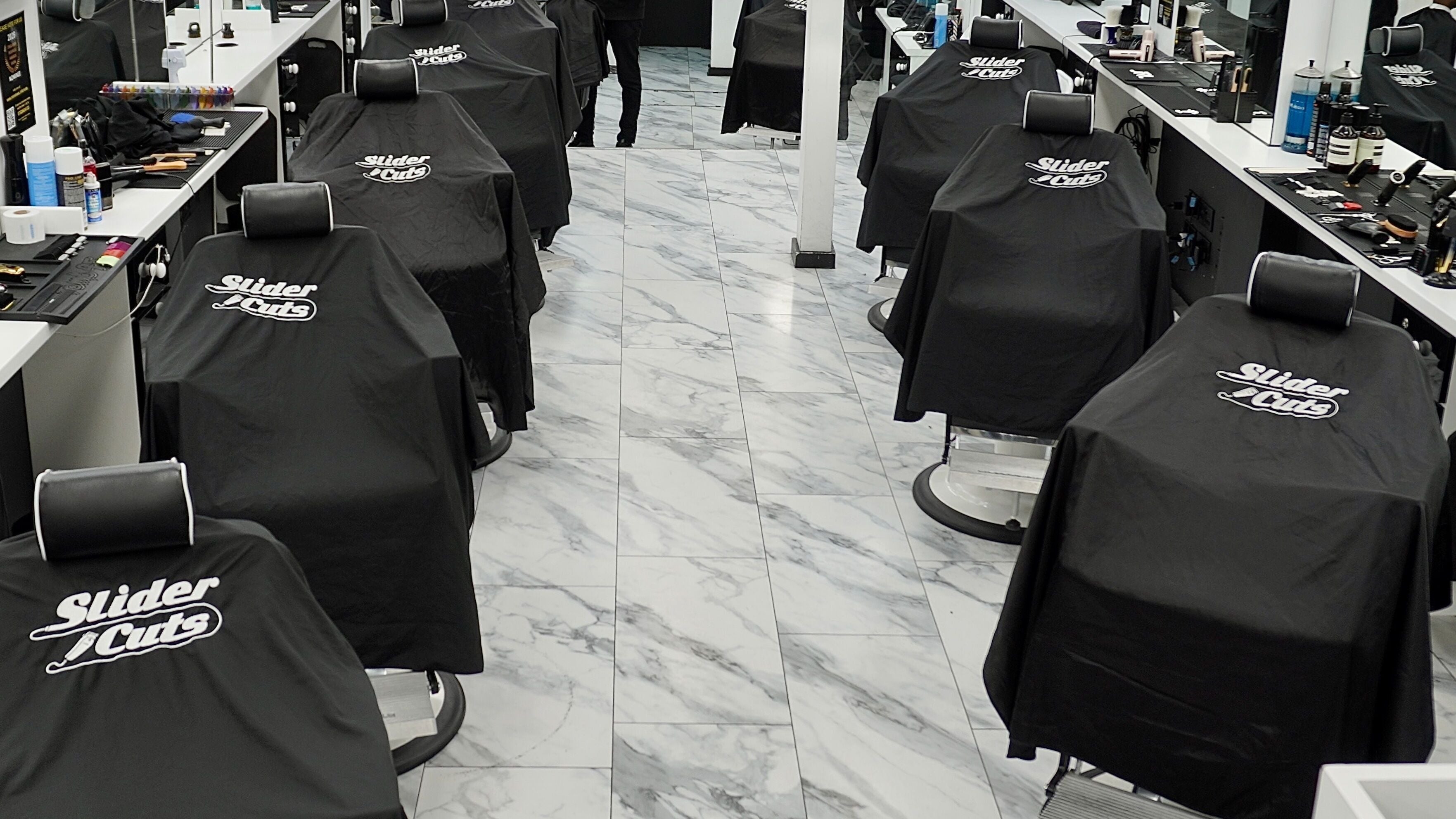 SliderCuts salon interior with stylish barber chairs, London, England, GB.