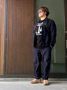 「闘魂SHOPのアイテム（Tシャツ/カットソー、ブラック系）」を使った、棚橋弘至さん（メンズ・181cm）の春コーディネート