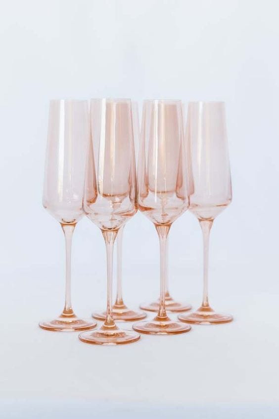 An image of hand-blown coloured champagne glassware