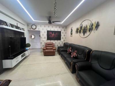 The balcony features plants, potted flowers, railing, and a light fixture at CasaGrand The Address, Karapakkam, Chennai