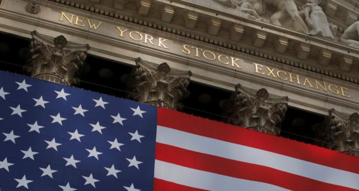 A US flag flies outside Wall Street at the  New York Stock Exchange