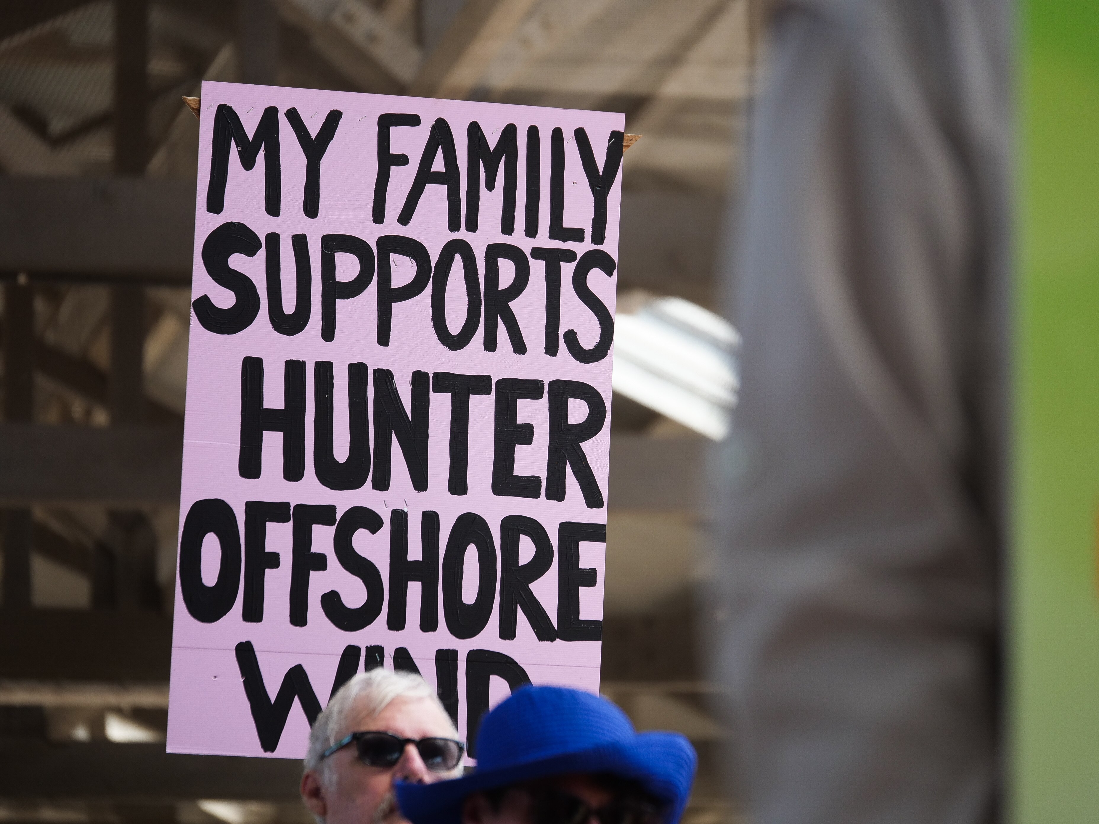 A placard that reads 'my family supports Hunter offshore wind'