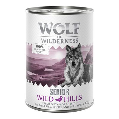 Lata de Wolf of Wilderness Senior Wild Hills, 400 g. Texto visible: 100% grain-free, Wild Hills, Senior. Sabor: pato y ternera con frutos del bosque, raíces y hierbas silvestres.
