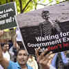 Supporters gather with placards at protest site