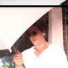 Article image for: <i class="tbold">Shah Rukh Khan</i> does it again! Actor uses umbrella to avoid paps