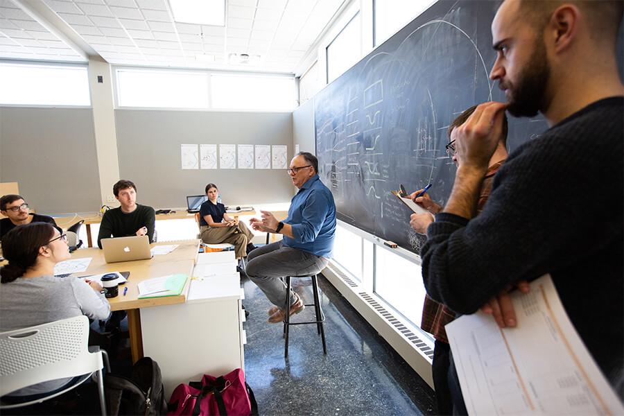 Students listen to a professor in a city-planning class.