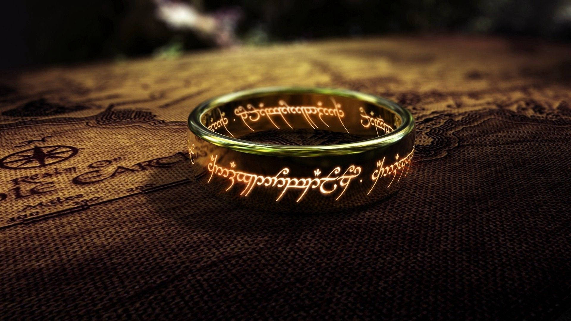 A glowing golden ring with Elvish script on a fantasy map.