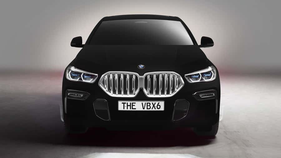 BMWX6 elegante y potente en un fondo de pantalla de alta resolución.