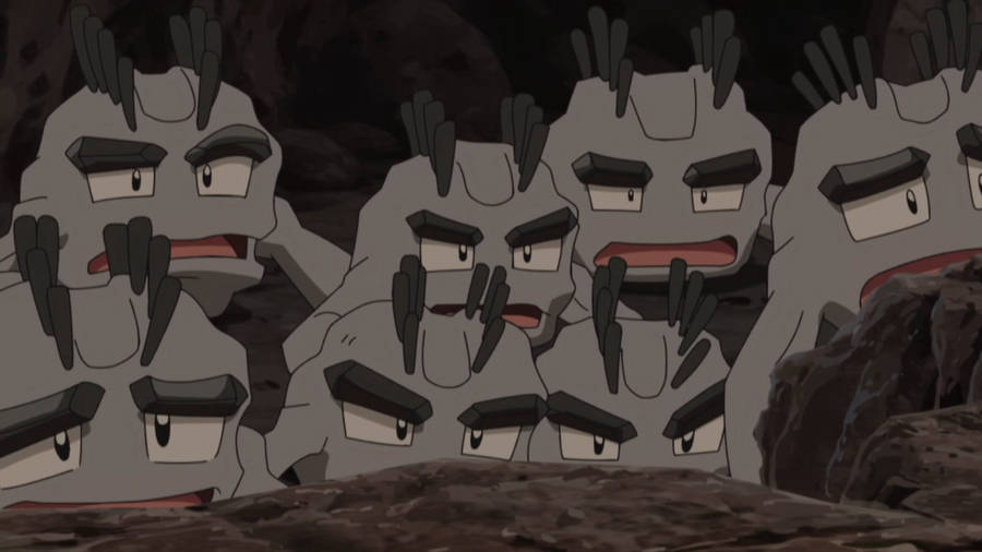 Syv Geodude Pokemon Med Forbløffede Udtryk På En Blå Baggrund