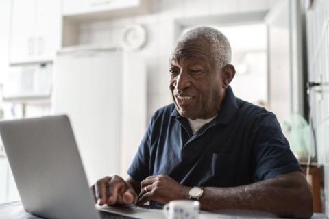 Older man using a laptop computer