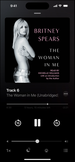 iPhone screen showing an audiobook. Below the cover art is playback controls, including a play button, volume slider, and jump ahead and jump back buttons