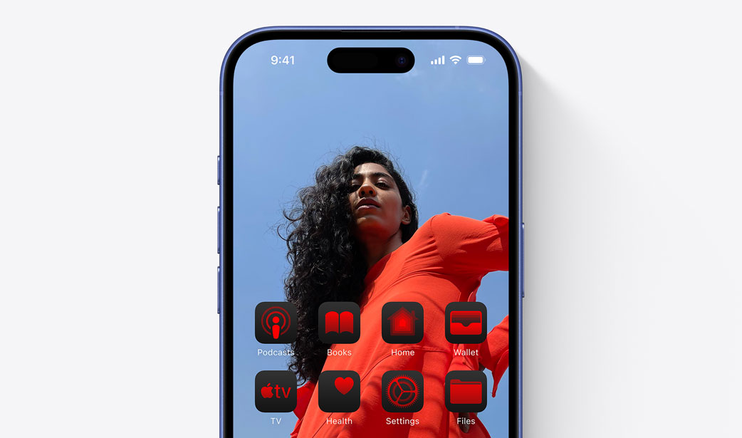 iPhone 16 screen with a photo of a girl in a red dress and widgets tinted a similar colour red.