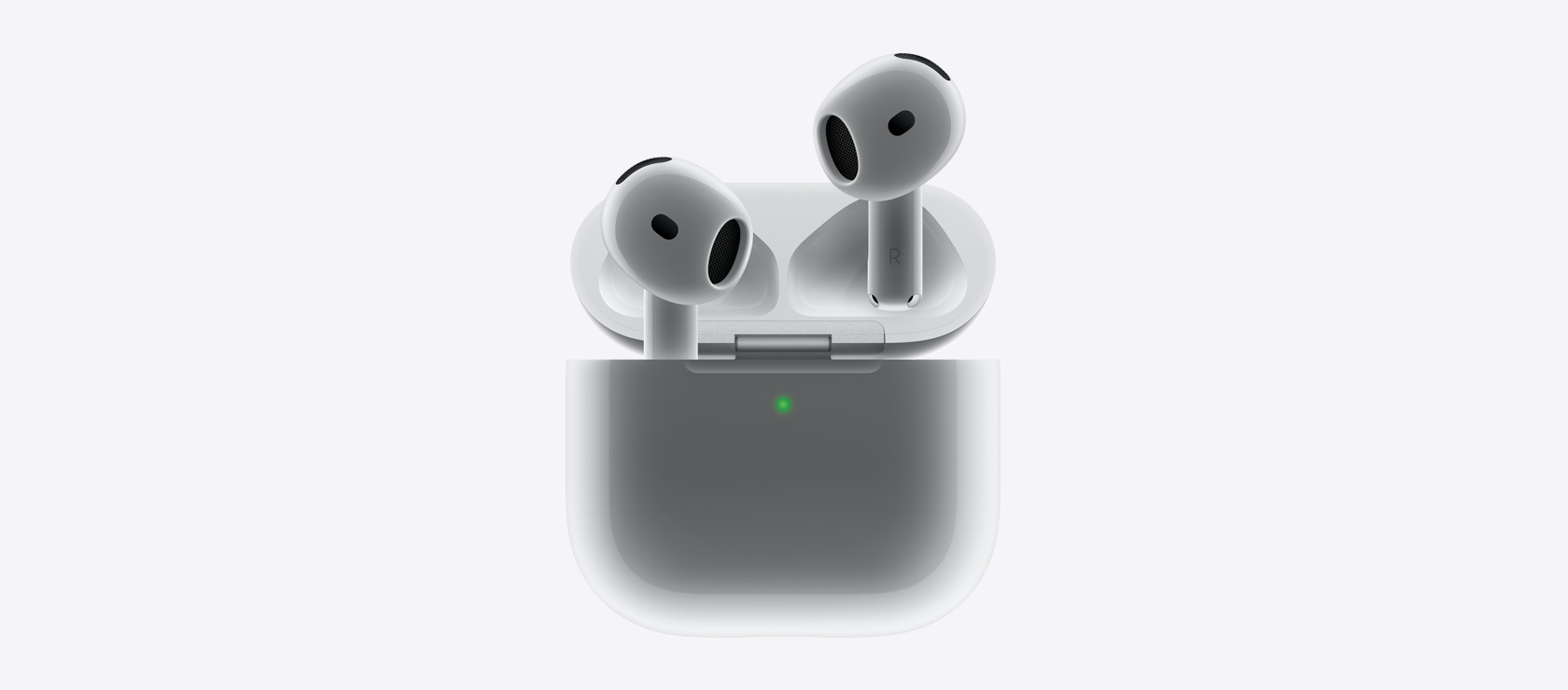 Slušalice AirPods 4 kako pristaju u kutijicu za punjenje.