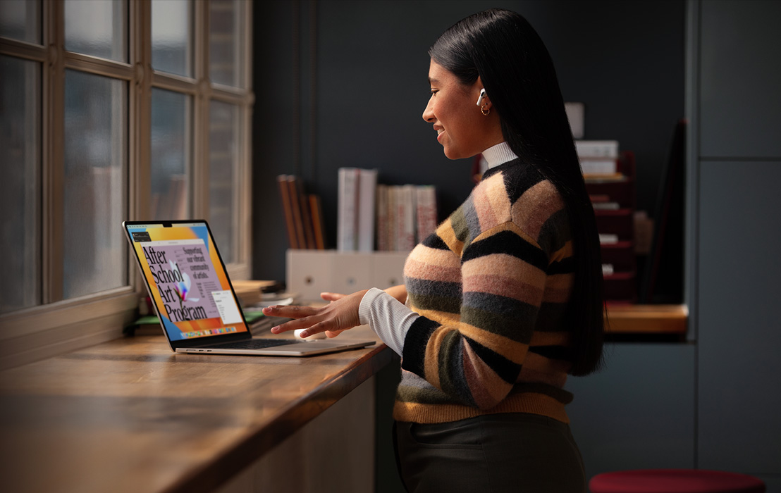 A uni student creates a flier on MacBook Pro