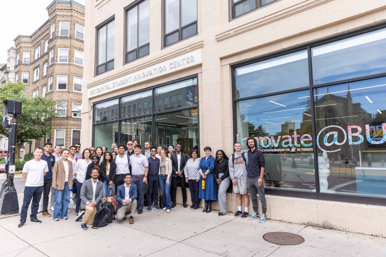 Group photo of students and employees standing outside IDG Capital Innovation Center