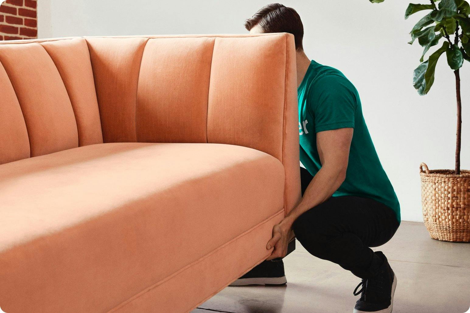 Person lifting couch for moving