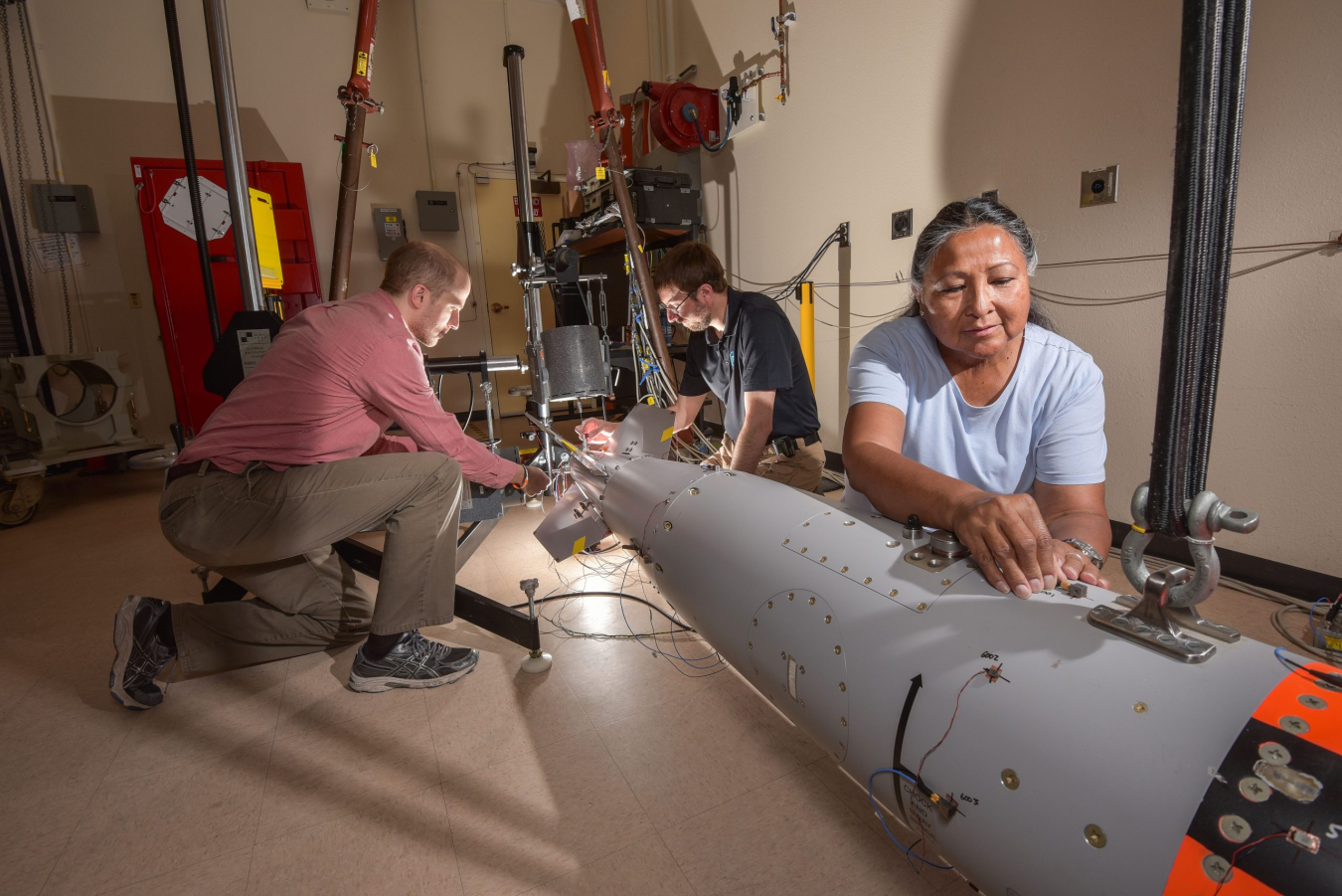 Workers at Sandia National Labs prepare a B61-12 for a safety test.