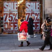 People passing shop window in Glasgow