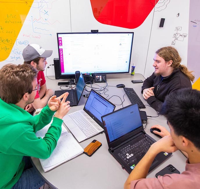 Engineering students meet to work on their capstone group project.