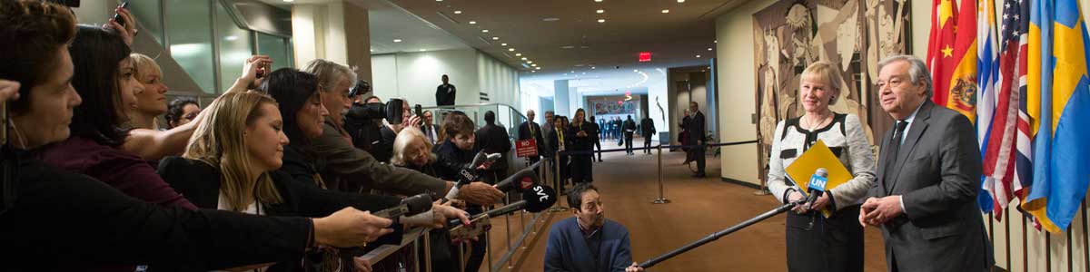 Journalists wait at the media stake-out. UN Photo/Mark Garten