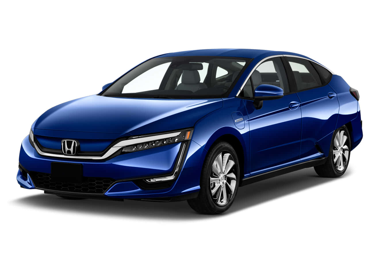 Sleek Honda Clarity in an urban landscape Wallpaper