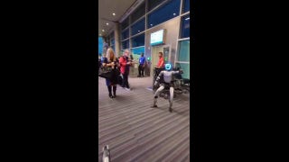 Dancing robot steals show at airport gate, briefly delays departing flight - Fox News