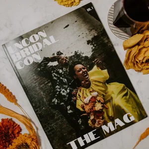 Colorful magazine titled ‘Uncon Bridal Con The Mag’ with people on the front in a floral suit and a yellow dress.