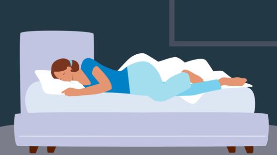 Person in bed sleeping on their side, covers off