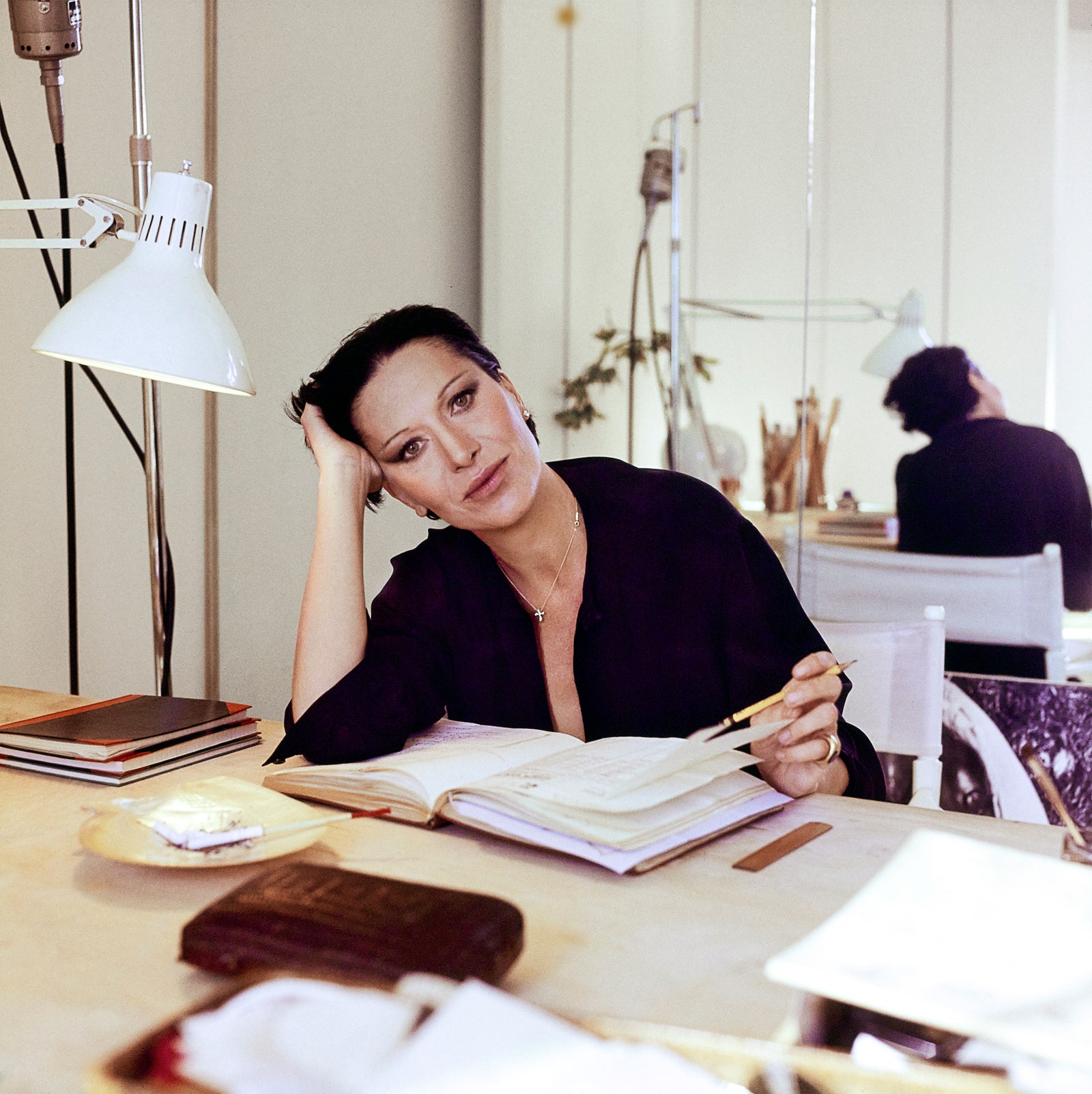 Image may contain Human Person Furniture Table Sitting and Desk