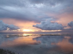 Photograph taken on Siquijor Island of the Philippines at sunset as low clouds reflected on the Bohol Sea.