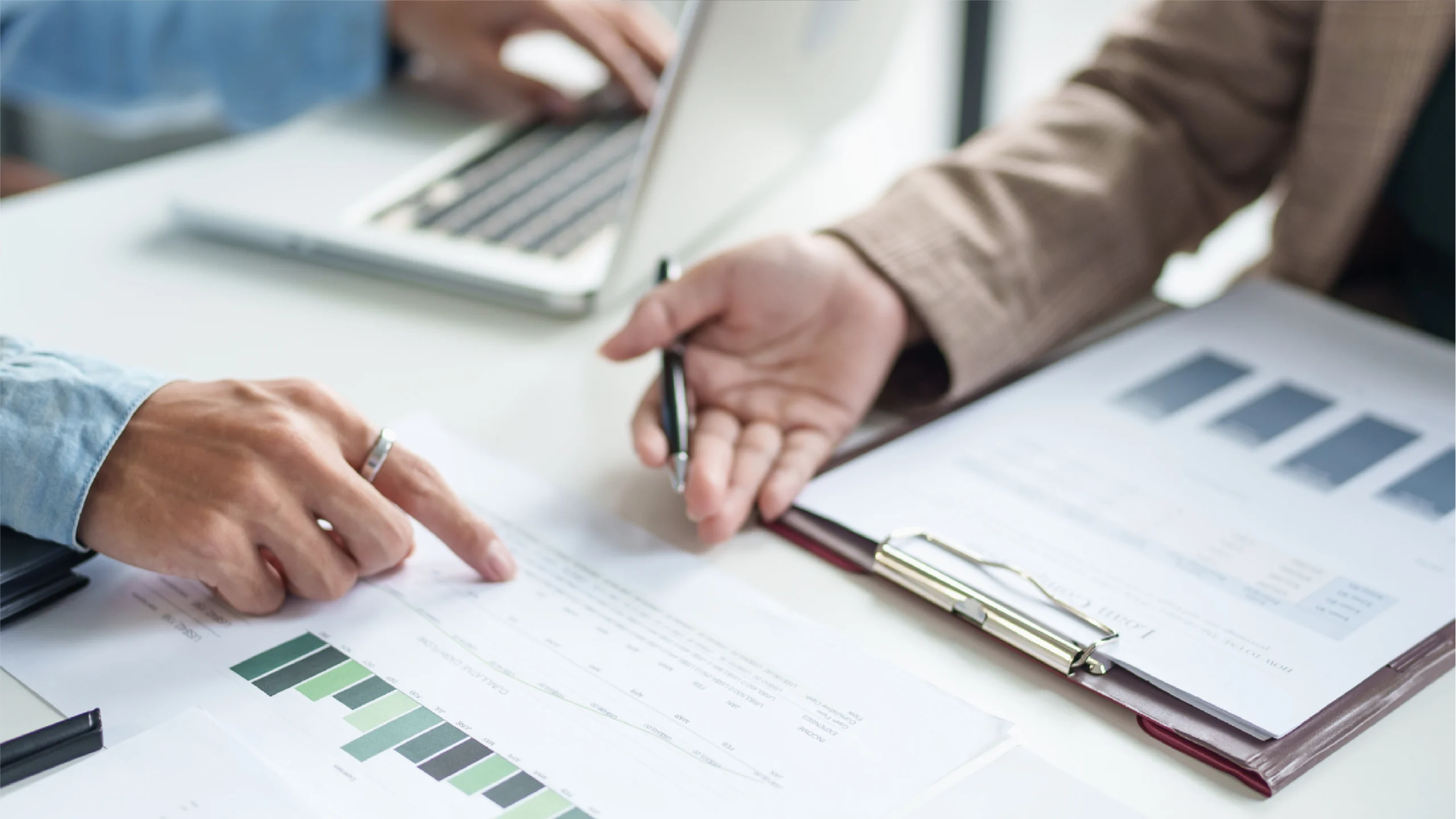 Three office managers showcasing manual billing with paper and clipboards