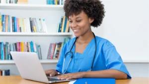A nurse initiating the healthcare billing process, recording information on a computer