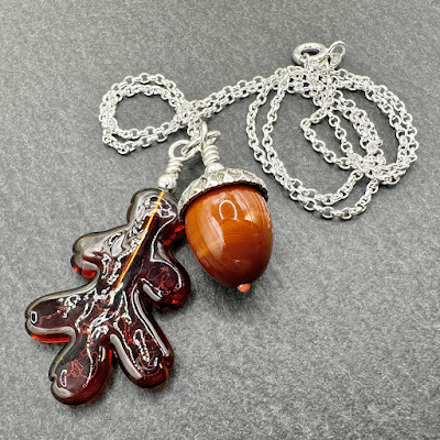 Sterling silver and lampwork glass 'Acorn and Oak Leaf' necklace by Laura Sparling Sterling silver and lampwork glass 'Acorn and Oak Leaf' necklace by Laura Sparling